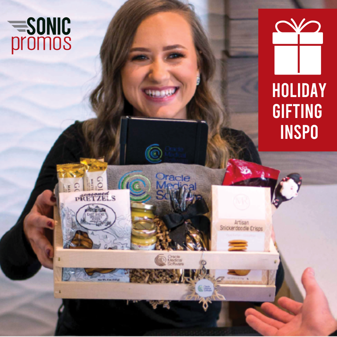 Holiday Gifting Inspo. A person holds a basket of branded treats
