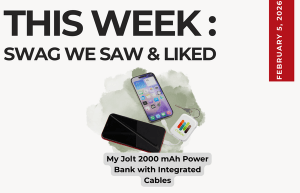 Text above reads "This Week: Swag We Saw and Liked." Pictured is the My Jolt 2000 mAh Power Bank with Integrated Cables. The power bank is connected to two different phones.