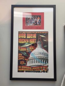 A framed concert photo and group photo