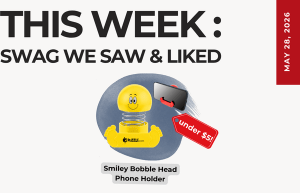 This Week: Swag We Saw & Liked — yellow smiley bobble-head phone holder with an 'Under $5' tag and a May 28, 2016 date on the side image.