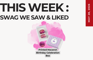 Promotional graphic: 'THIS WEEK: SWAG WE SAW & LIKED' with pink splash and a macarons box labeled 'Printed Macaron Birthday Celebration Box' and a red May 28, 2016 vertical banner