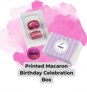 Printed Macaron Birthday Celebration Box. Open box showing two macarons shown next to closed box