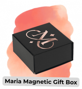 Black rectangular gift box with a silver logo on the lid, on a peach background; label reads 'Maria Magnetic Gift Box'.
