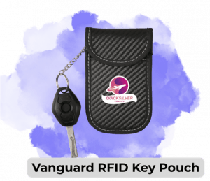 Vanguard RFID key pouch in black carbon-fiber texture with a living key and fob on a chain beside it.