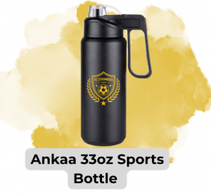 Black 33-ounce sports bottle with a built-in handle and gold crest logo, placed on a yellow paint-splatter background; label reads 'Ankaa 33oz Sports Bottle'