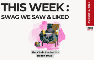 Promotional poster: 'This Week: Swag We Saw & Liked' featuring a tropical chair with a pink splash background and a beach towel pattern.
